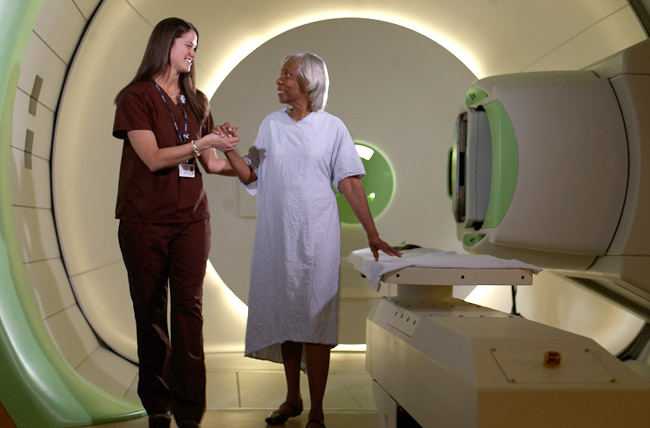 Nurse walking a patient during cancer treatment